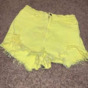 Yellow ripped shorts